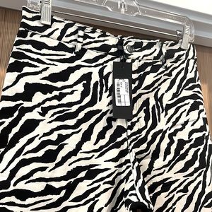 Motel rocks zebra print, bootcut/ flare fit pants. BRAND NEW. Size small.